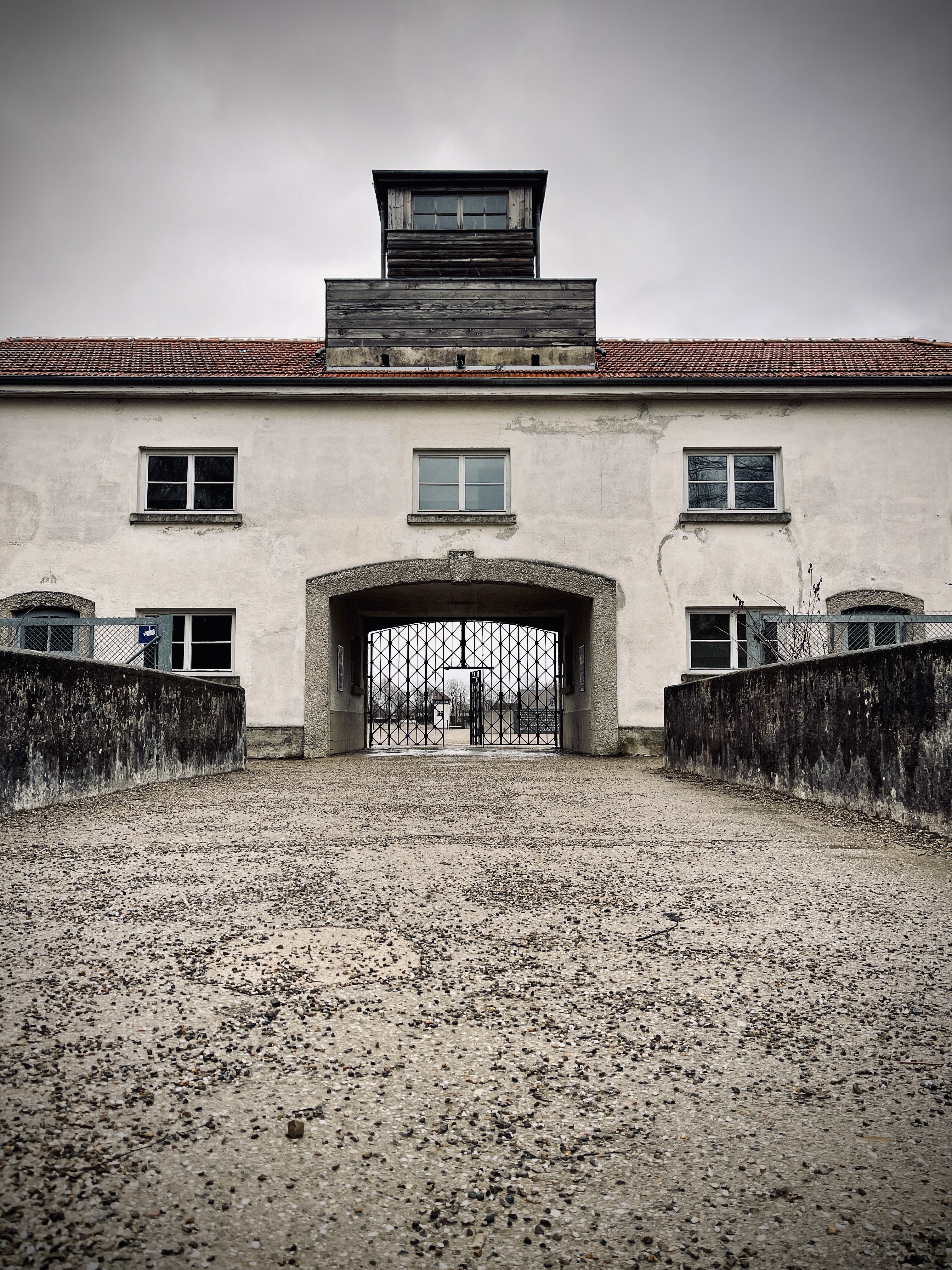 The Jourhaus gatehouse at Dachau, the path leading to the iron gate
